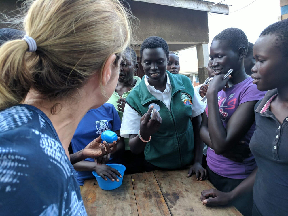 Leisa Hirtz, CEO of Women's Global Health Innovations, with students in Palorinya
